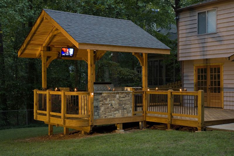 A wooden porch with TV and lighting installation in Atlanta