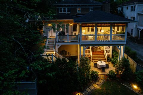 A beautifully lit home highlighting Decks & More’s award‑winning outdoor design.